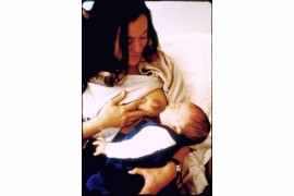 Marina breastfeeding with milk squirting. NY. 2000
