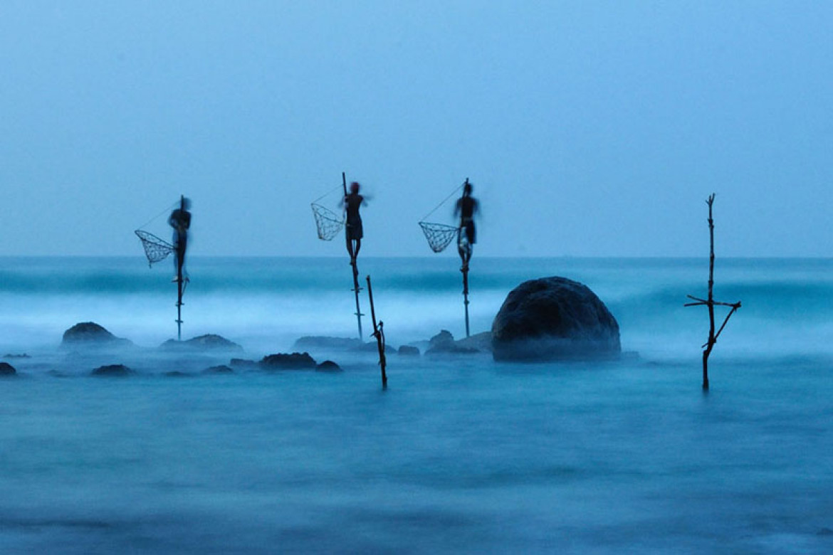 Honorowe wyróżnienie w kategorii Ludzie: Stilt Fishing, Ulrich Lambert (c) Ulrich Lambert/National Geographic Photo Contest
