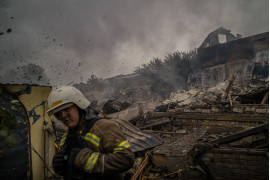 Zniszczone w wyniku nalotu rakietowego domy cywilne w Kupiańsku na Ukrainie, 10 października 2022
fot. Wojciech Grzędziński